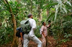 Guide Jose Magaña, a practicing Mayan healer who’s well-versed in the native flora of Elijio Panti National Park, teaching Alex Schechter.