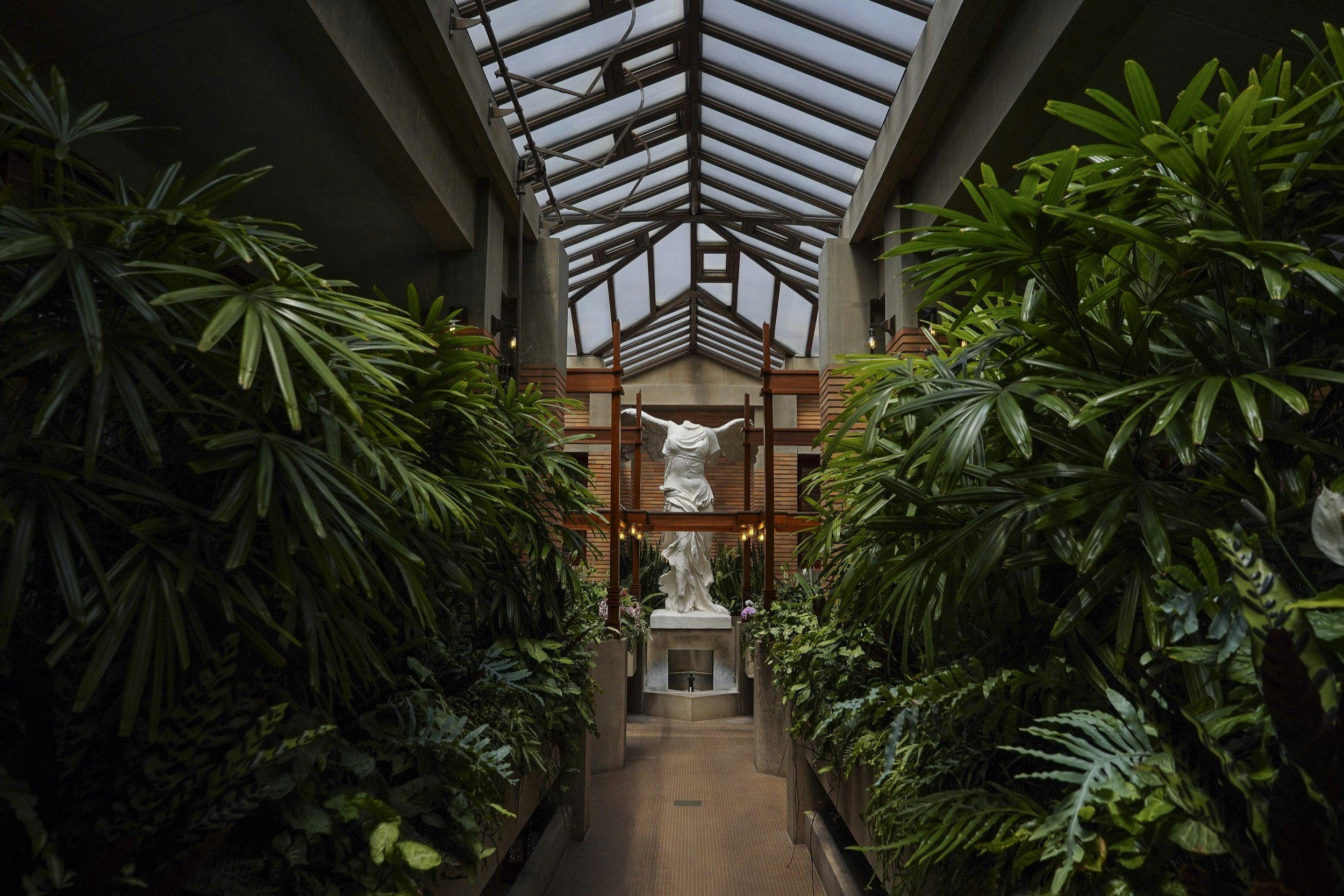 A statue of Nike of Samothrace presides over the conservatory at the Martin House, designed by Frank Lloyd Wright, in Buffalo