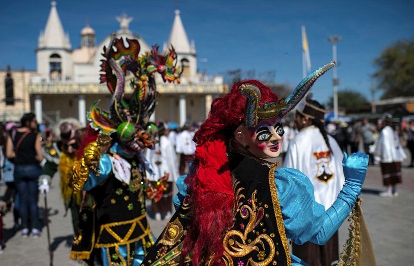 Dancers in traditional costumes perform during "La Tirana" religious carnival, in the streets of La Tirana, 78 km east of Iquique, northern Chile, on July 15, 2019. - The celebration, an Andean festivity related to mining workers and farmers in honour of the Virgin of Carmel, is the largest religious holiday in northern Chile. (Photo by Martin BERNETTI / AFP)        (Photo credit should read MARTIN BERNETTI/AFP via Getty Images)