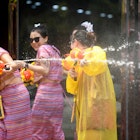 XISHUANGBANNA, April 15, 2019 -- People celebrate the water-sprinkling festival on a street in Jinghong City, Dai Autonomous Prefecture of Xishuangbanna, southwest China's Yunnan Province, April 15, 2019. People sprinkle water to each other to pray for good fortune during the traditional water-sprinkling festival, which is also the New Year festival of the Dai ethnic group. (Xinhua/qinqing via Getty Images)