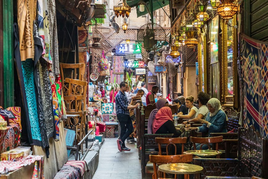 People sit in an alleyway at the Khan al-Khalili coffee shop in Cairo.