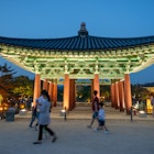 One pavilion of the Donggung Palace, Gyeongju, South Korea - Gyeongju, South Korea - June 5, 2019: One pavilion of the Donggung Palace with visitors, shot at dusk