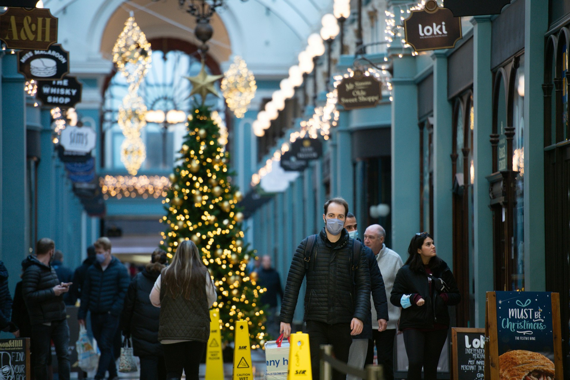 Christmas shoppers stroll through the historic Great Western Arcade in Birmingham, England