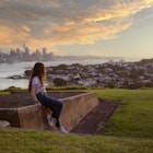Girl admiring the view towards Auckland from North Head
