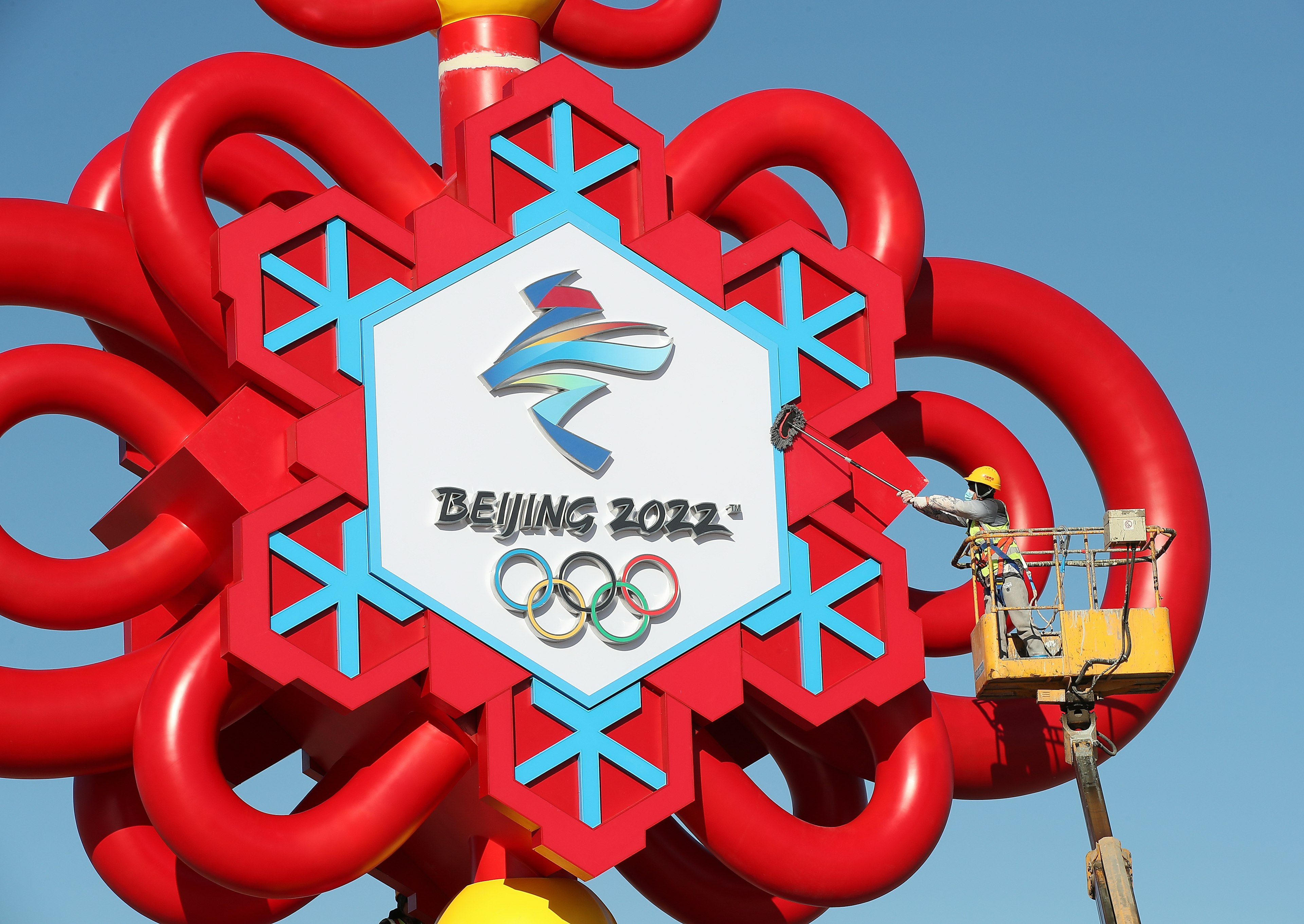 Big Winter Olympics-themed Chinese Knot Installed At Tian'anmen Square
BEIJING, CHINA - JANUARY 13: A worker clears the Winter Olympics-themed Chinese knot installation at Tian'anmen Square on January 13, 2022 in Beijing, China. (Photo by Wang Xin/VCG via Getty Images)