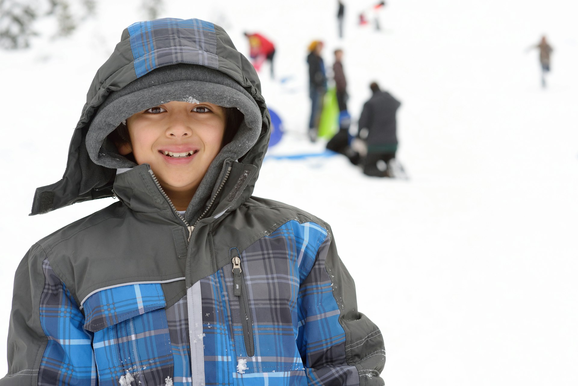 Eleven year old boy with jacket on the snow