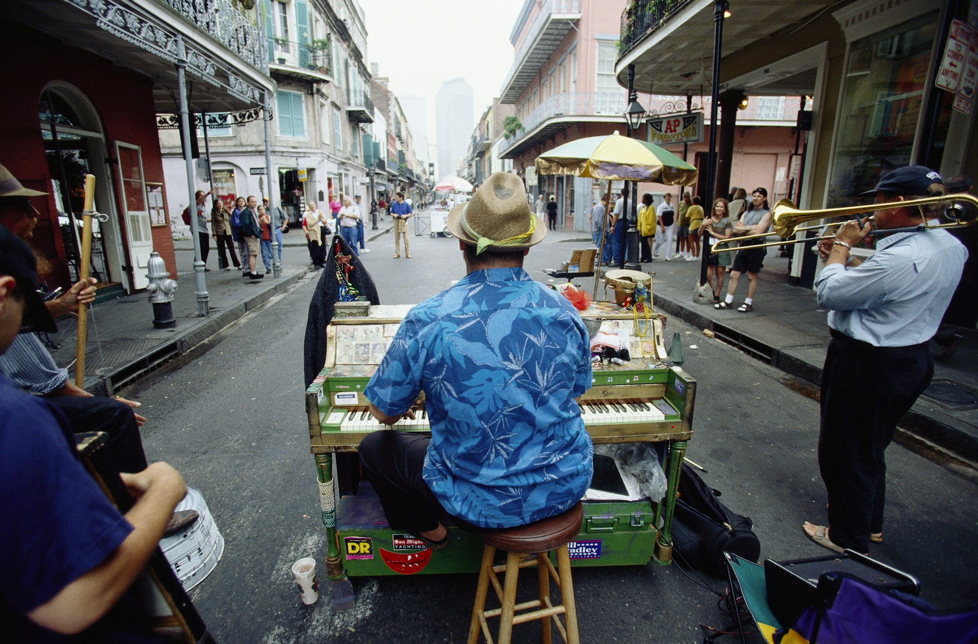 David Roe, a pianist, performs on his colorful piano along with fellow street musicians in Royal Street in New Orleans.