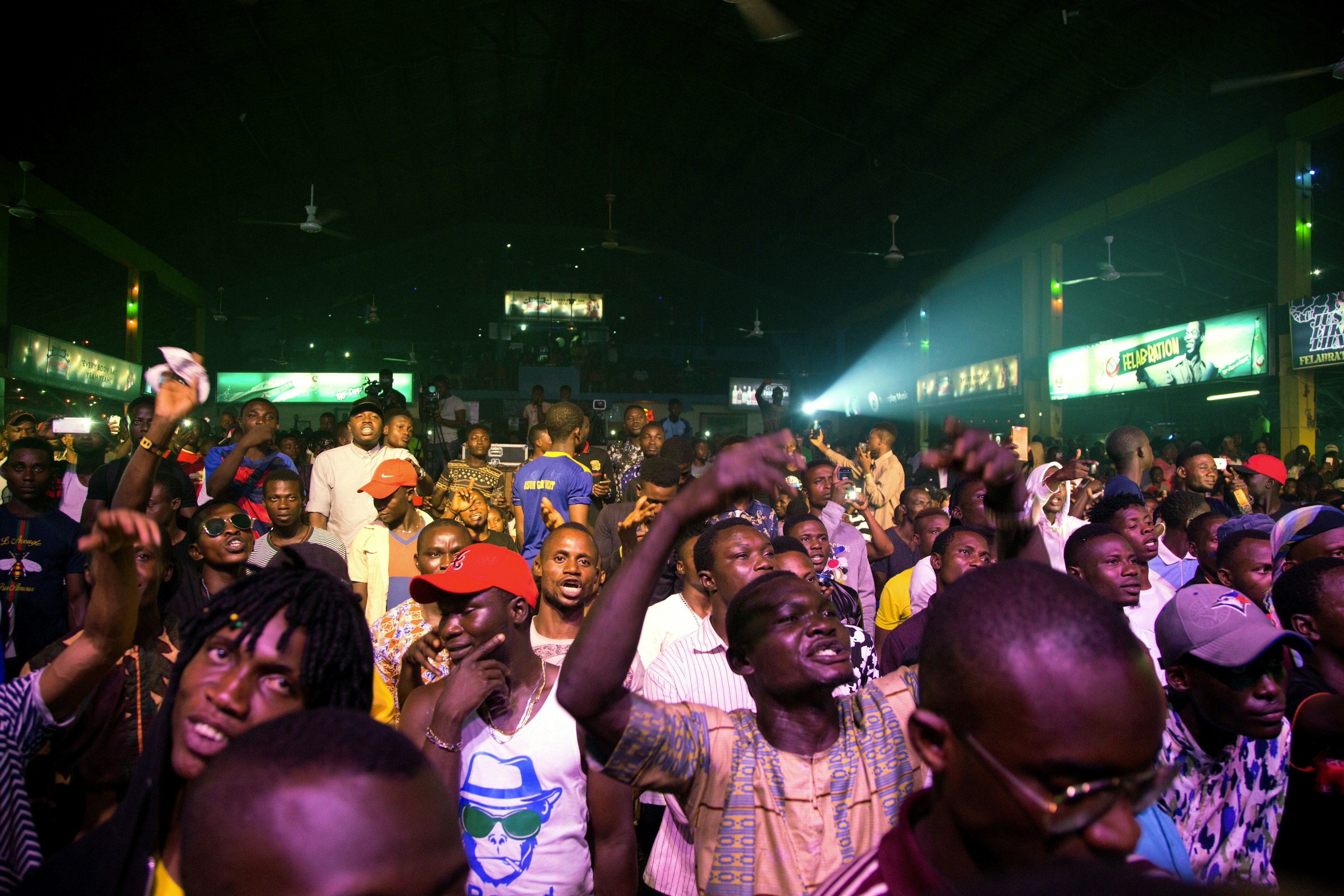 Afrobeat enthusiasts dance at night during the annual Felabration Musical Concert in Lagos