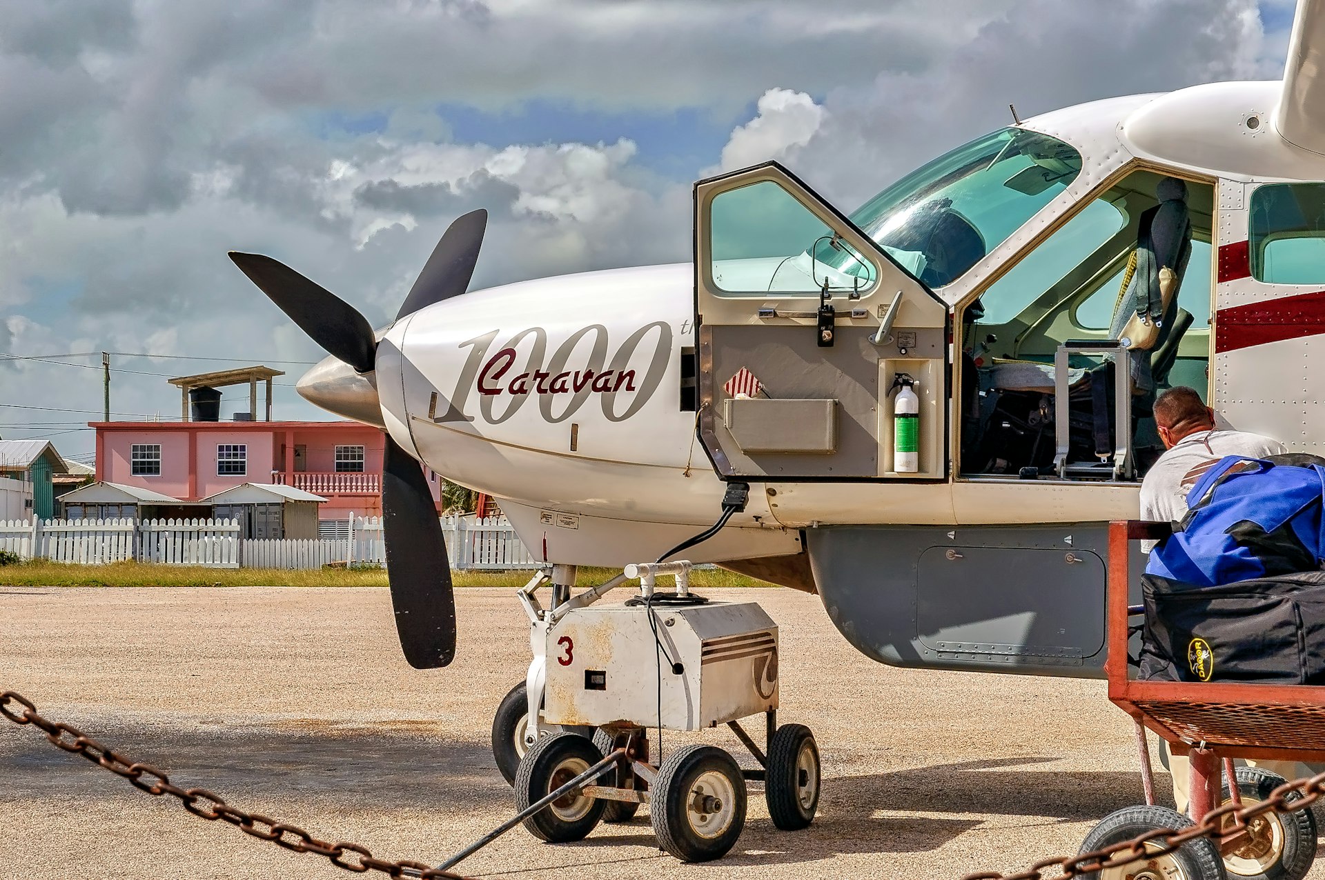View of Cessna Caravan 1000 airplane getting ready to depart from San Pedro airport in Belize.