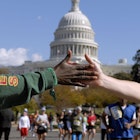 UNITED STATES - OCTOBER 29: JoAnn Thomas of the District, encourages a runner in the 31st Marine Corps Marathon as they pass the west front of the Capitol. (Photo By Tom Williams/Roll Call/Getty Images)
