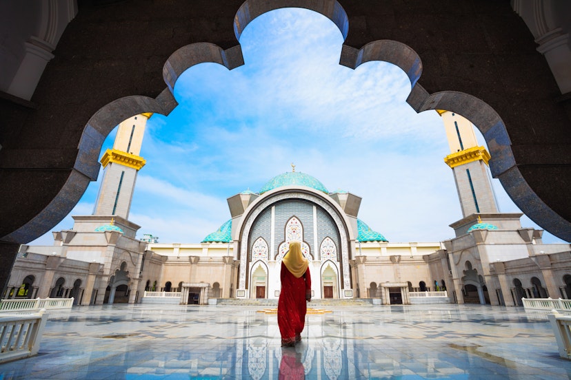 A woman enters the Federal Territory Mosque.