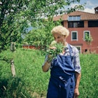 Slovenian Chef Ana Roš picks herbs at her farm in the Slovenian mountains near Hisa Fanko