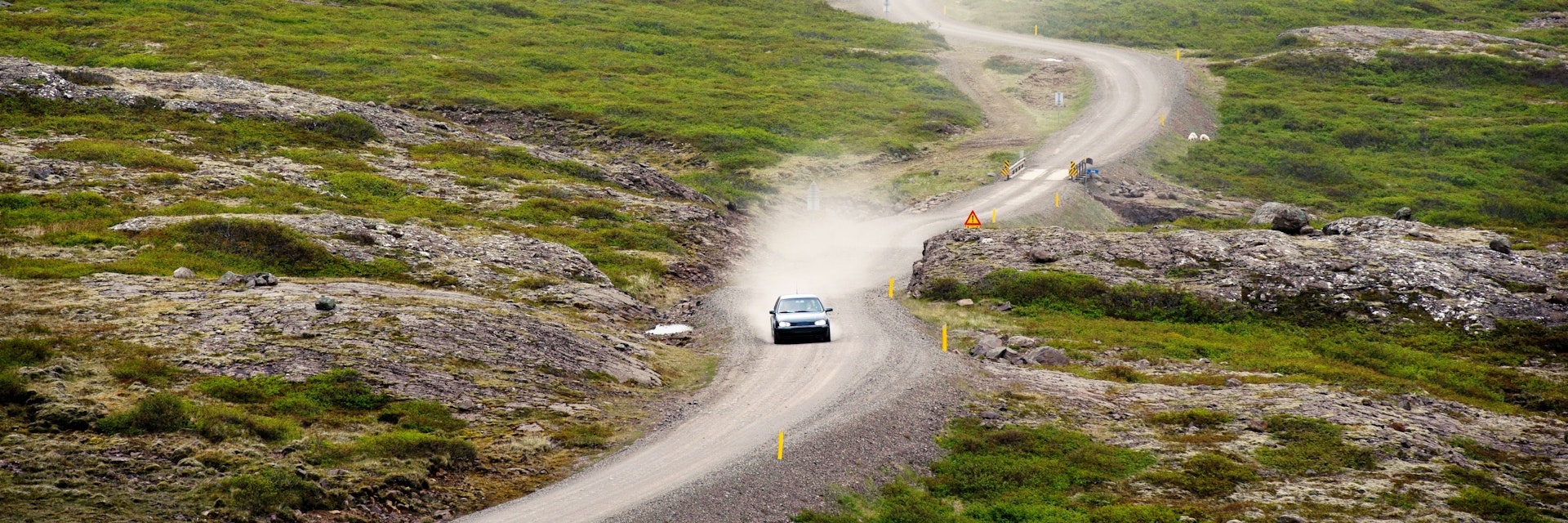 A car on the Öxi mountain pass, Eastern of Iceland - stock photo
Öxi pass is a mountain pass in eastern region, Iceland.