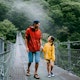 Happy father and his young daughter walking on bridge, Iya Valley, Tokushima, Shikoku, Japan