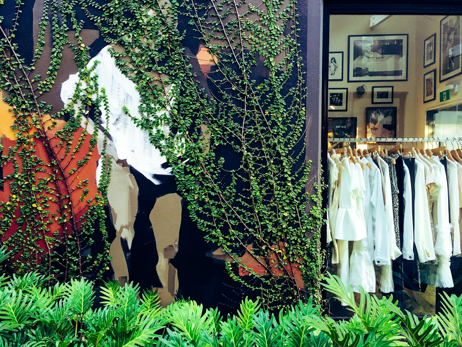 White garments seen through the window of a designer boutique on St James Street, Brisbane