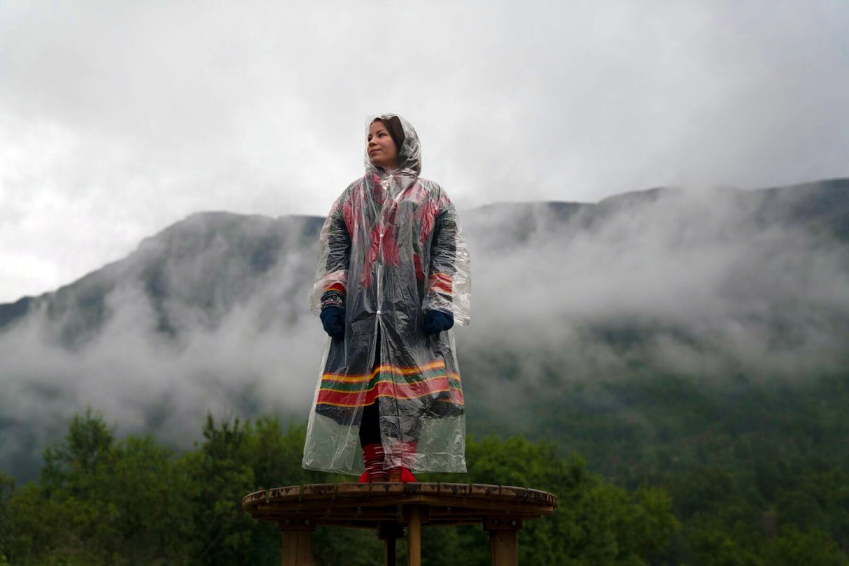 A woman stands amid the mist at Riddu Riddu Festival in Norway.