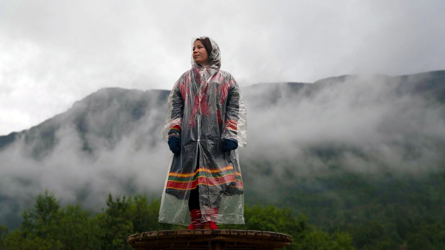 A woman stands amid the mist at Riddu Riddu Festival in Norway.