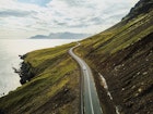 car driving on beautiful road, travel background, aerial scenic landscape from Iceland
