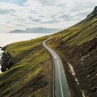 car driving on beautiful road, travel background, aerial scenic landscape from Iceland