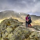 Young hikers on Striding Edge and Helvellyn in the Lake District national park - stock photo
