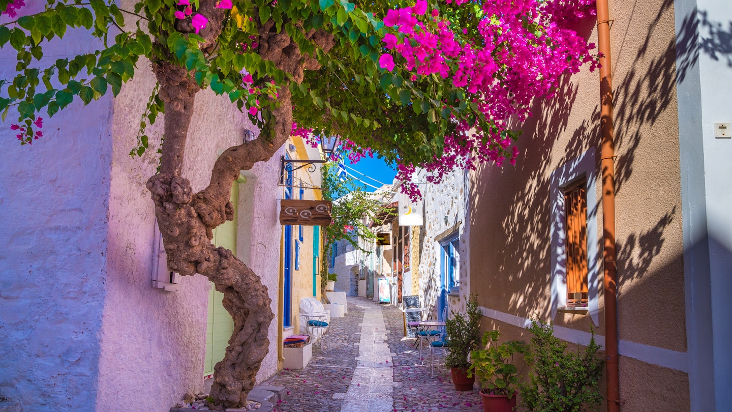 A colorful narrow alley of Ano Syros cycladic greek island
