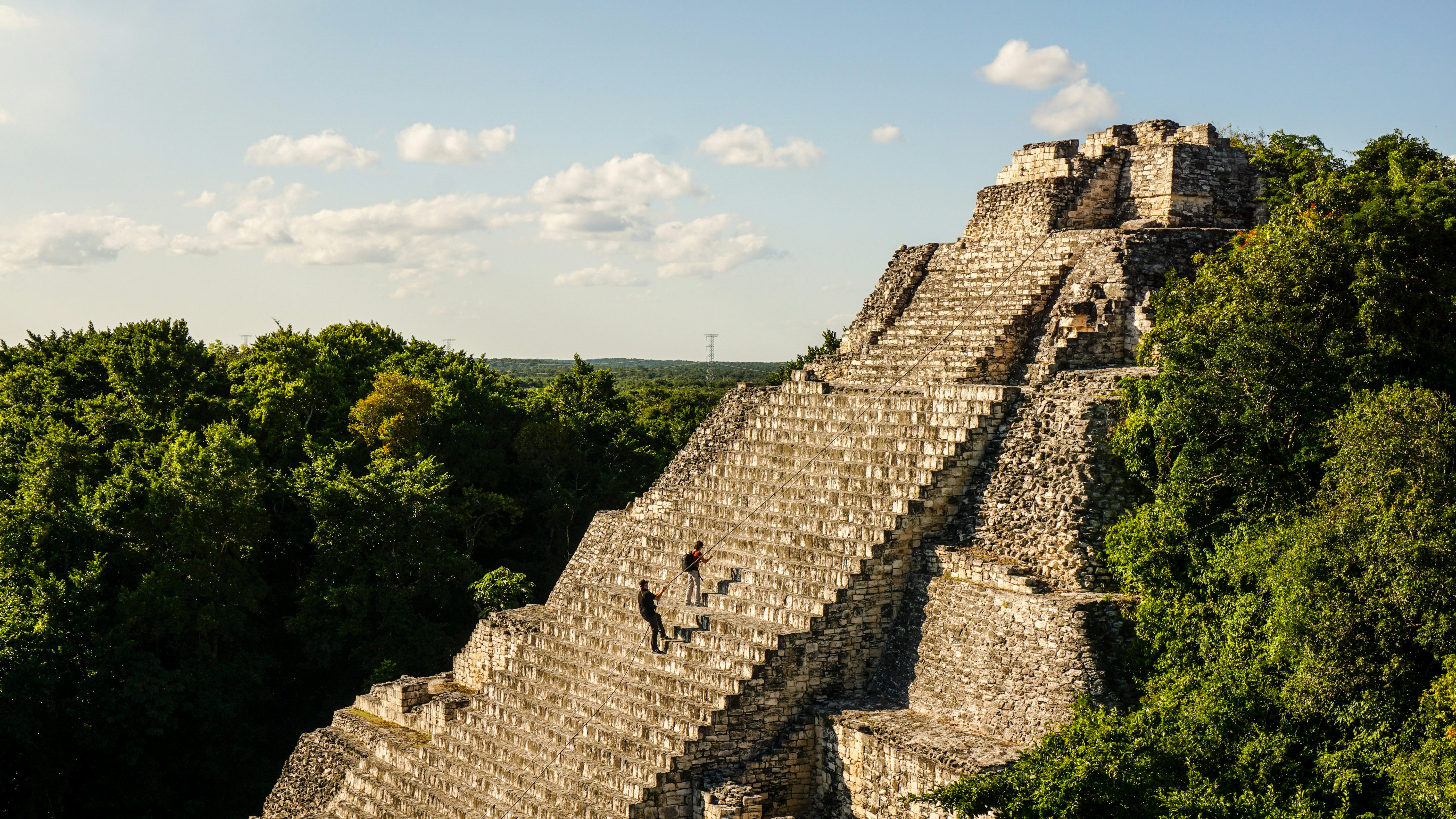 People use ropes to scale the stairs at the Becan Maya Ruins.