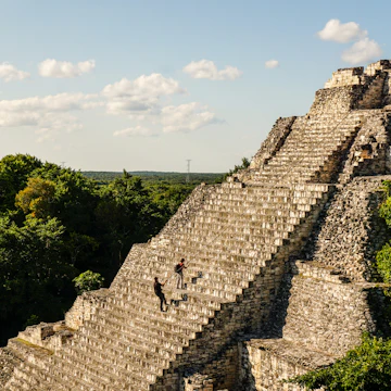 People use ropes to scale the stairs at the Becan Maya Ruins.