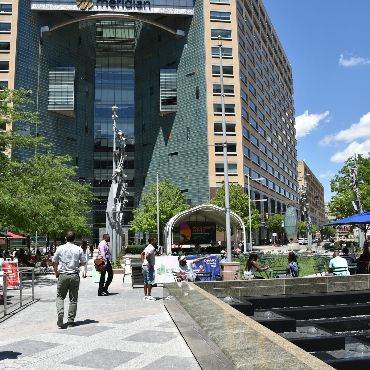 JUNE 30, 2019: Pedestrians walking around Campus Martius park.