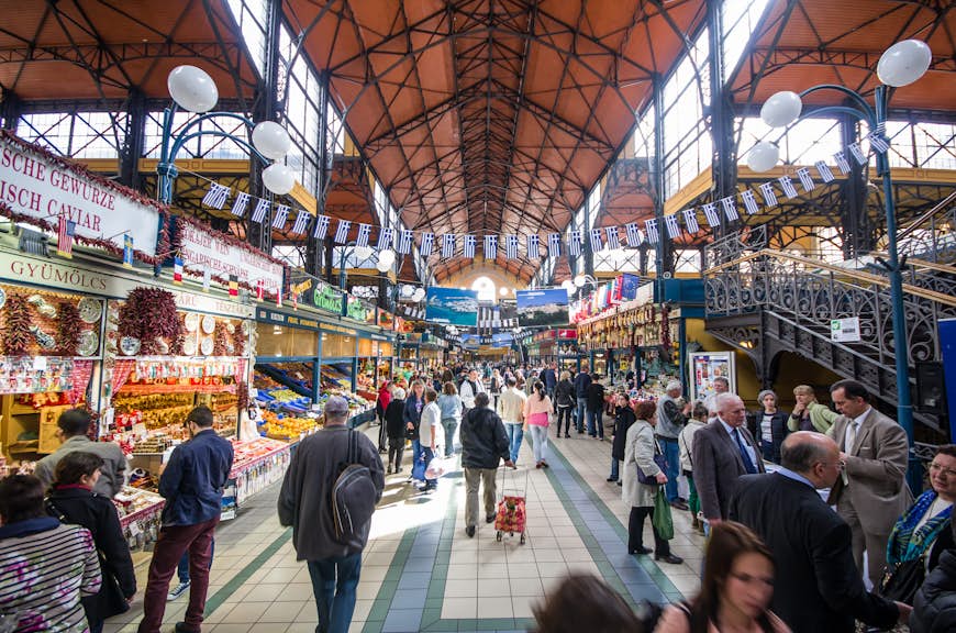 Visitors among the food stalls the Great Market Hall (Nagycsarnok) in Budapest