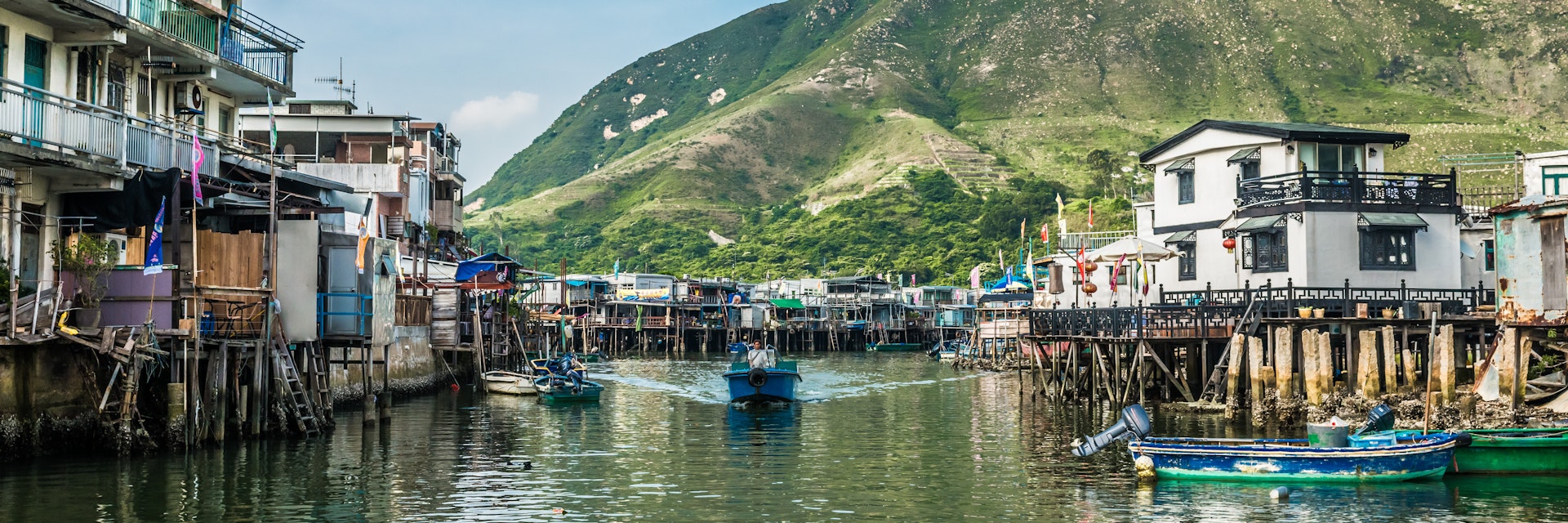 Tai O, Hong Kong, China- June 10, 2014: stilt houses and fishermen motorboats in Lantau island