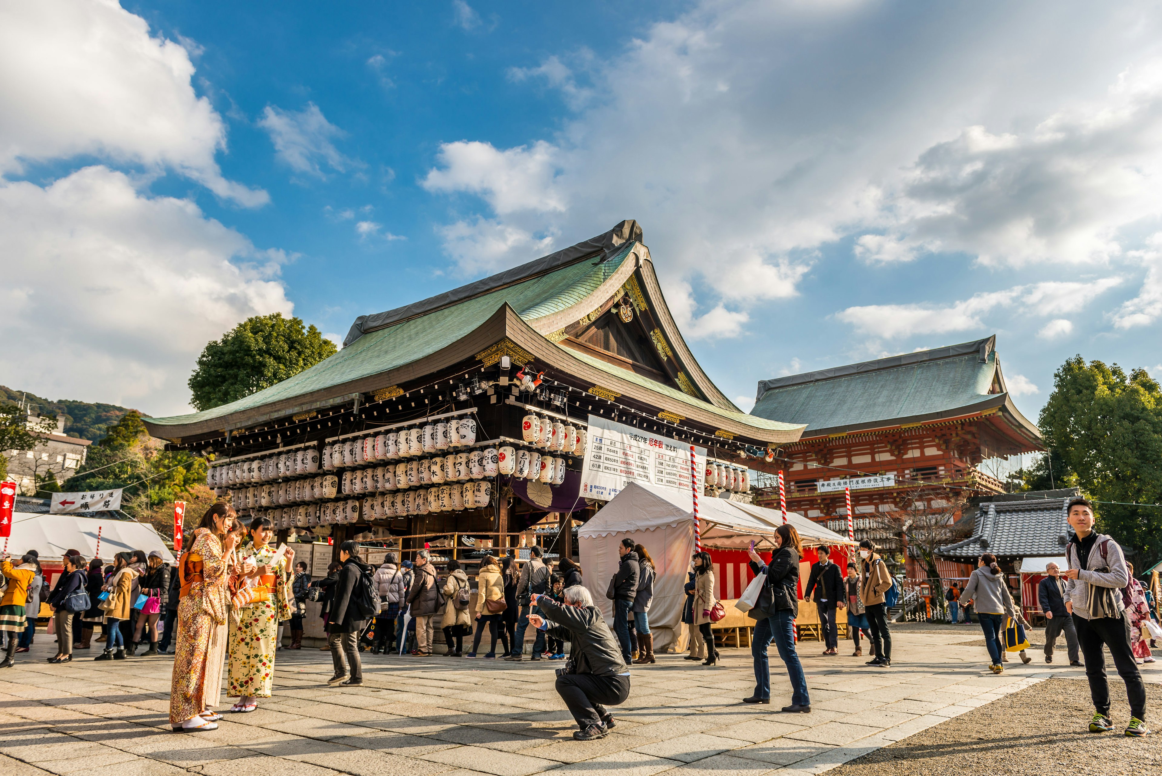 KYOTO, JAPAN - DECEMBER 29: Tourists and local Kyotoites explore the grounds of Yasaka Shrine on December 29, 2014 in Kyoto, Japan.
