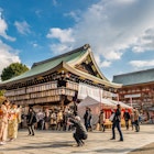 KYOTO, JAPAN - DECEMBER 29: Tourists and local Kyotoites explore the grounds of Yasaka Shrine on December 29, 2014 in Kyoto, Japan.