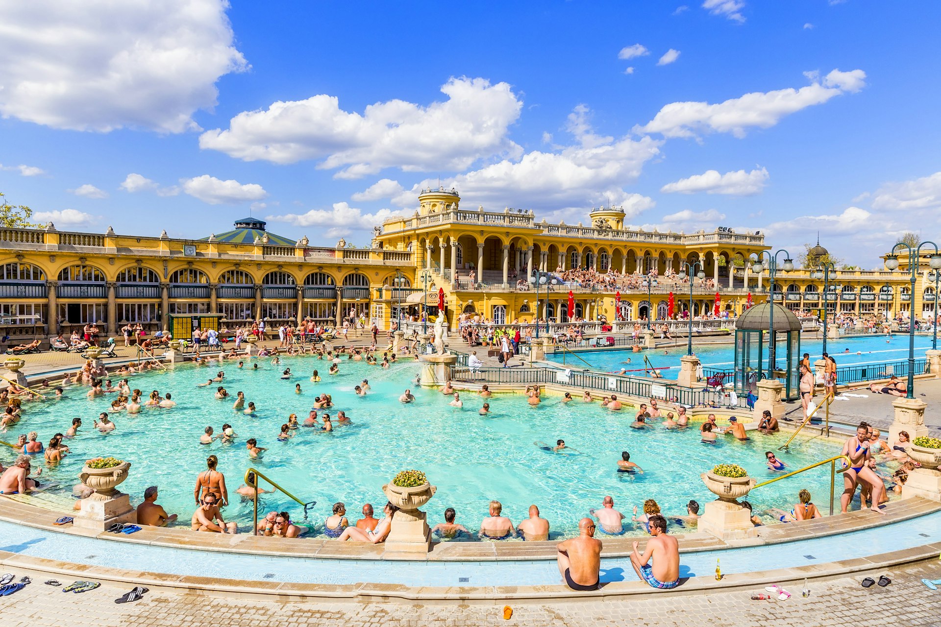 A crowd of bathers at Budapest’s famous Széchenyi Baths on a sunny day