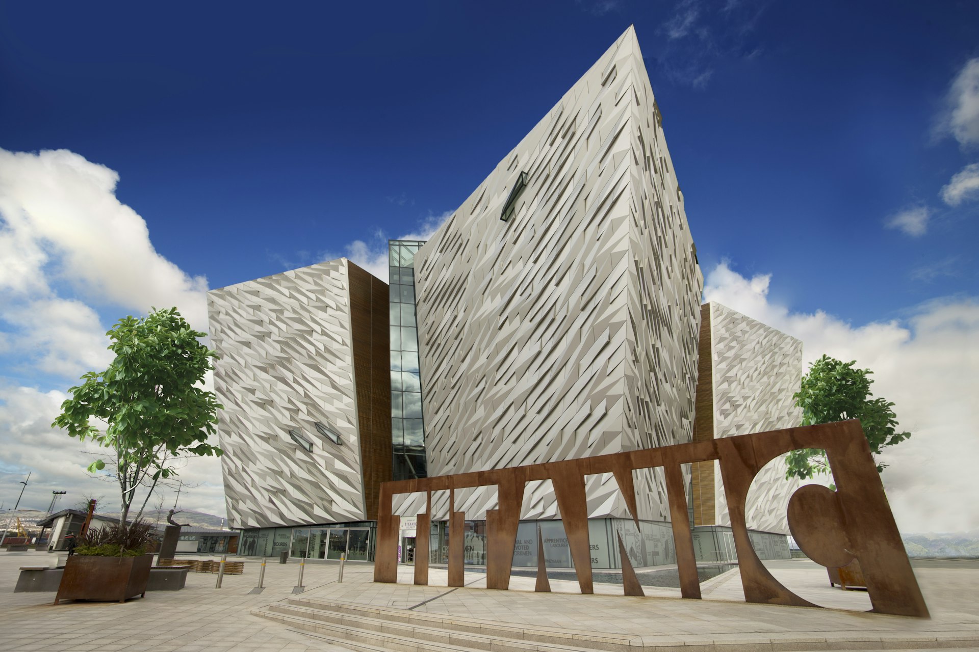 Titanic Belfast, Museum and Visitors Center on the place where Titanic was built with Titanic Sign in front of the building.