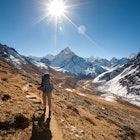 Trekker in Khumbu valley in front of Mt Abadablan, on the way to Everest Base camp.