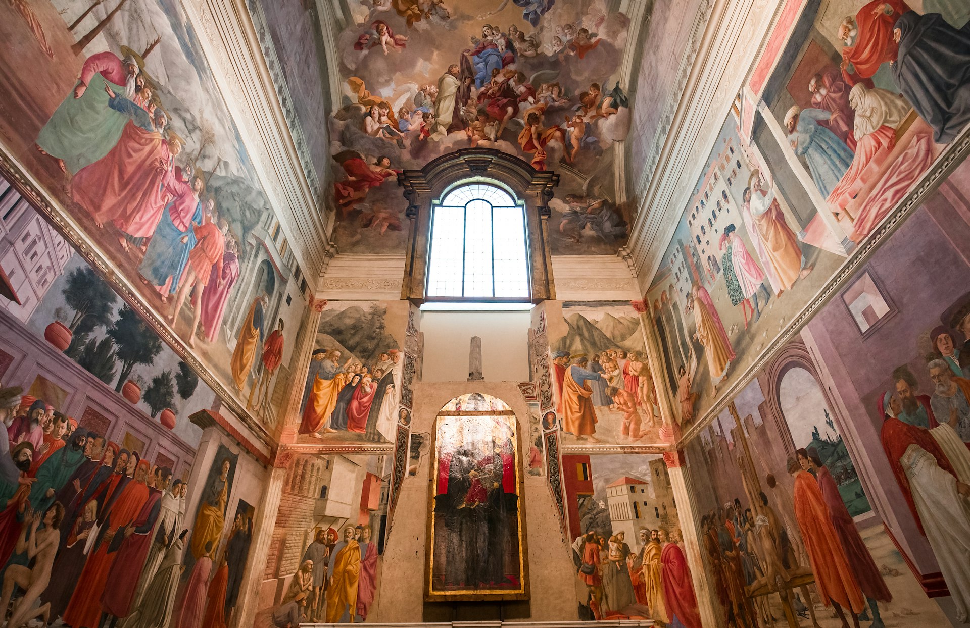 Looking up at walls with frescoes by Masaccio, Masolino and Filippo Lippi in the Brancacci Chapel