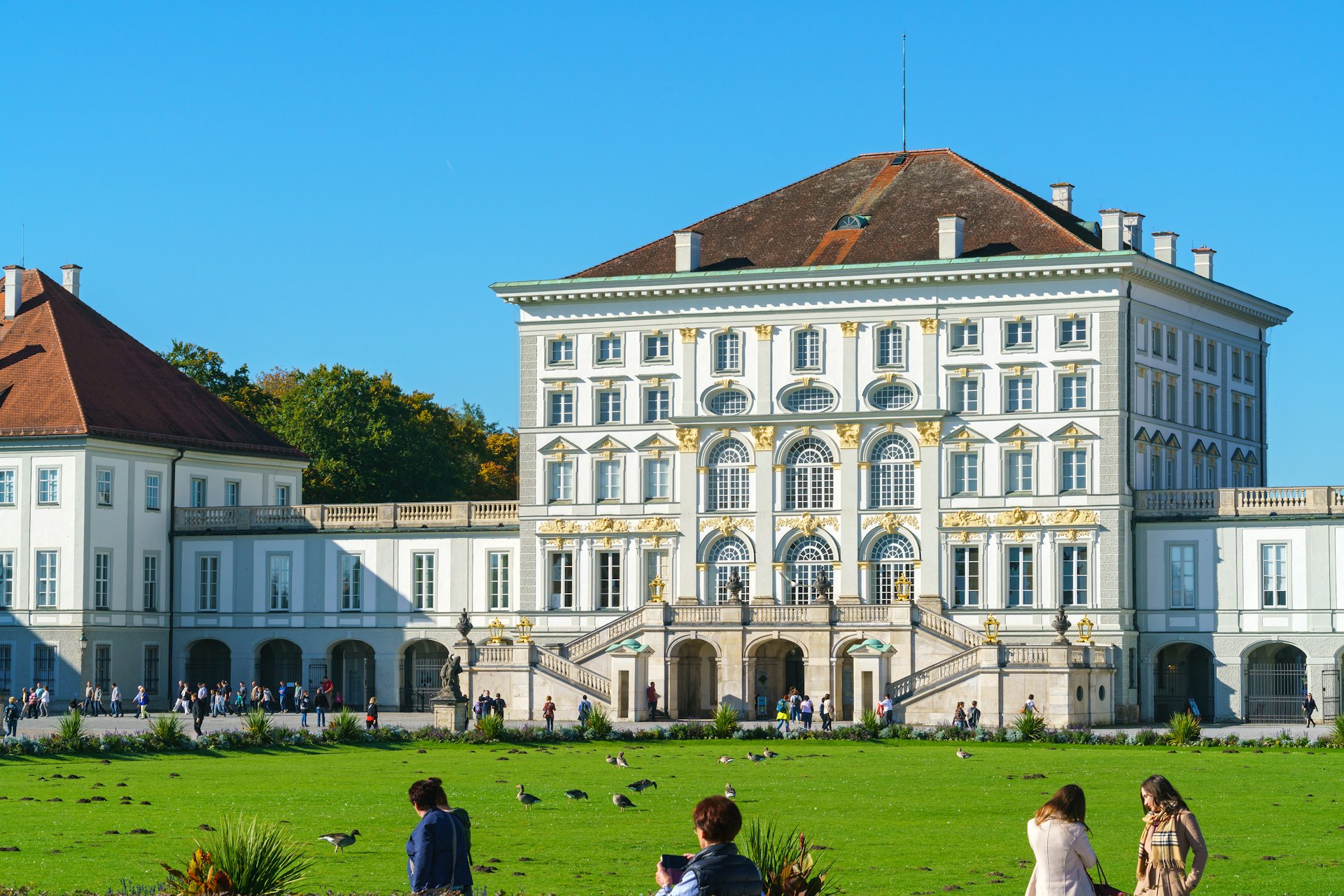 Visitors on the lawn in front of the Nymphenburg Palace, Munich