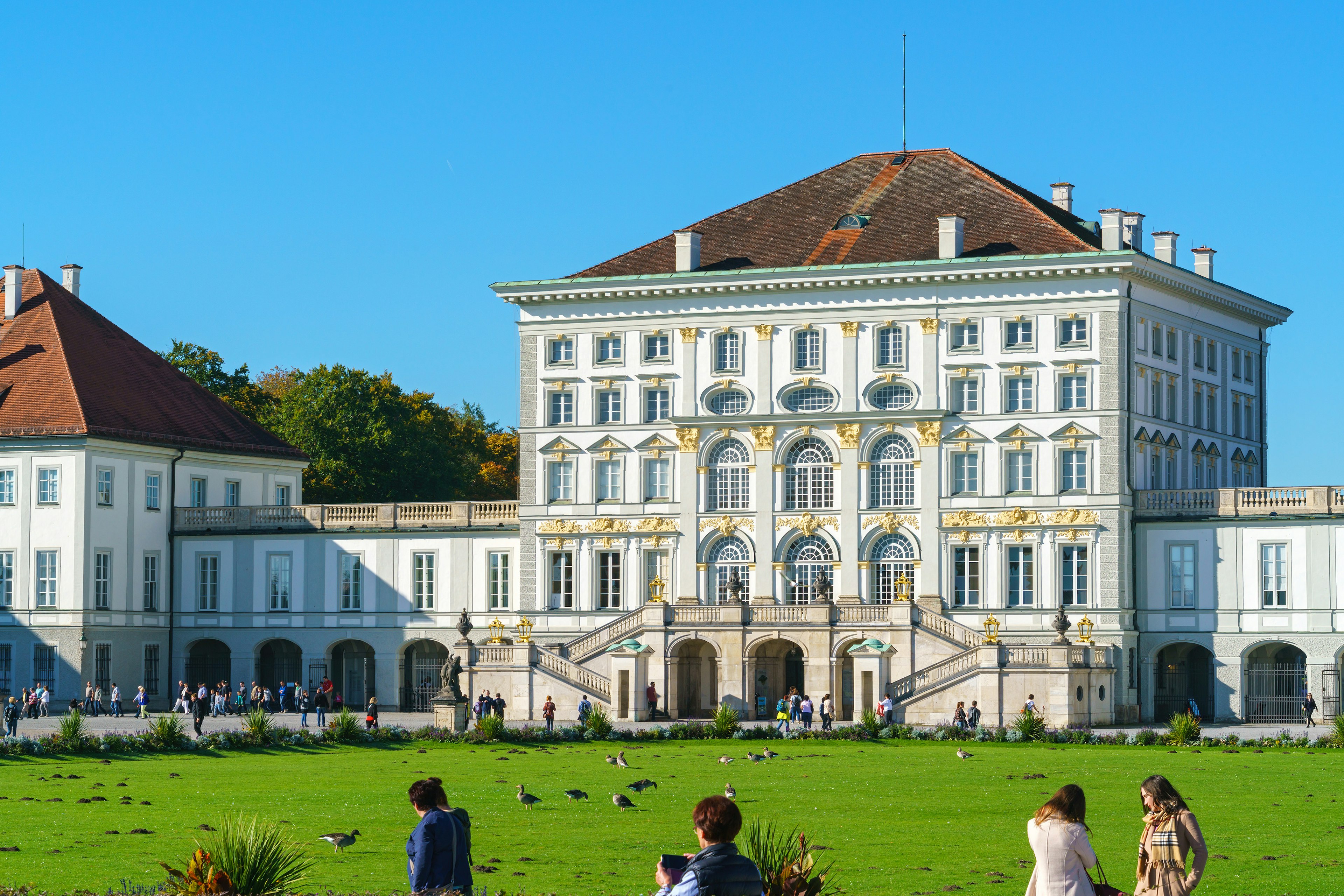 Visitors on the lawn in front of the Nymphenburg Palace, Munich