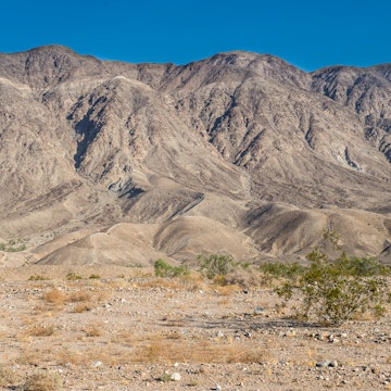 landscape, mountains by the road from Mexicali to Tijuana, in the Baja peninsula, MEXICO on a sunny morning, and a blue sky.