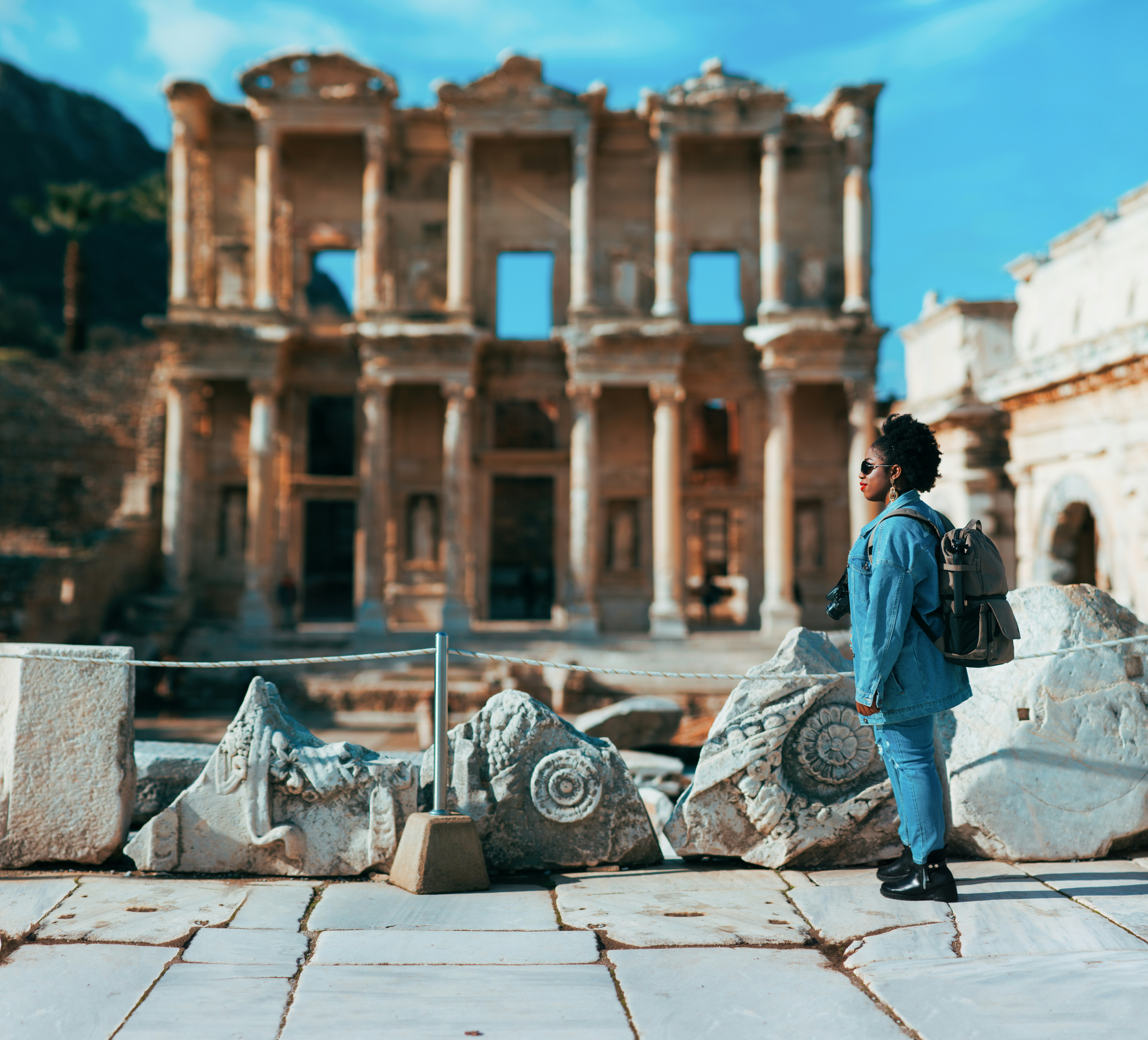 Woman admiring the ruins of Ephesus on a sunny winter day, Izmir