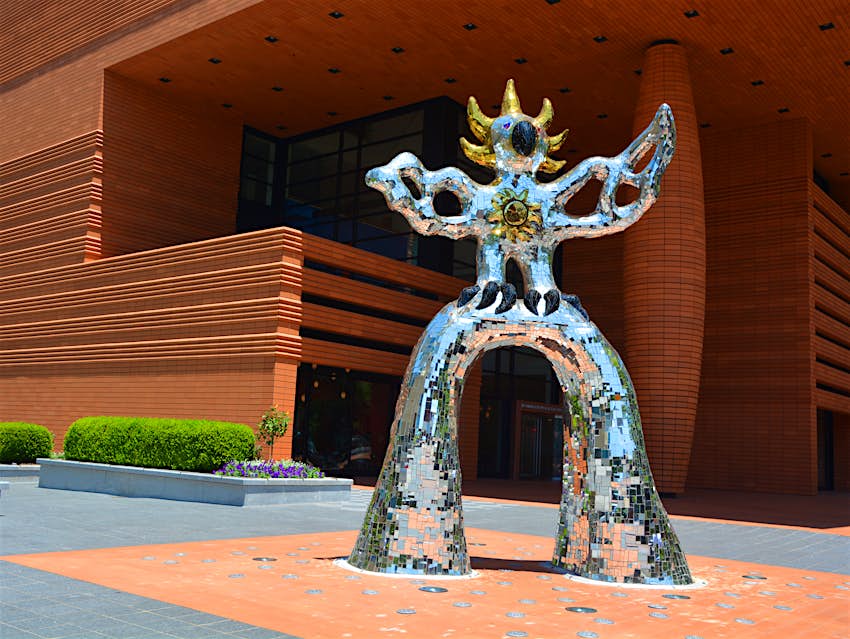 A silver and gold sparkly sculpture outside the Bechtler Museum in North Carolina