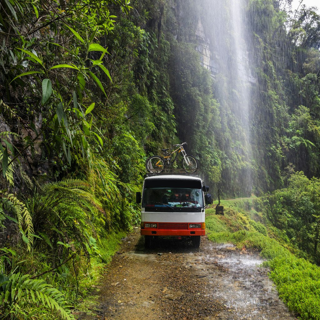 Bus at the Death Road - the most dangerous road in the world, North Yungas, Bolivia. - stock photo