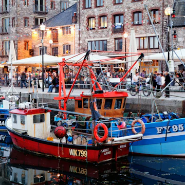 Fishing vessels and terraces of Pubs and restaurants, Barbican, Old harbour, Plymouth, Devon - stock photo