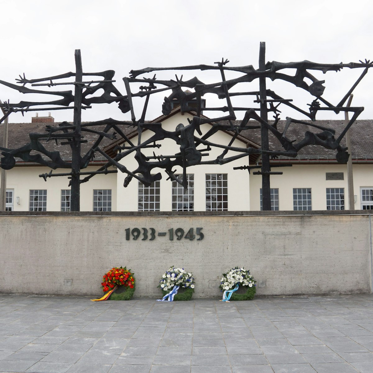 Munich/Germany-September 8 2017:.Exterior of camp facilities with memorial sculpture and wall,  at Dachau Concentration Camp, Munich, Germany.; 
KZ-Gedenkstätte Dachau

Shutterstock ID 760718488; your: Bridget Brown; gl: 65050; netsuite: Online Editorial; full: POI Image Update