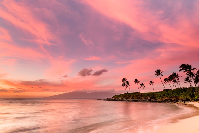 A pink sky above the lovely beach called Kapalua Bay, in Maui, Hawaii