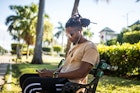 Man using smart phone in a park in Havana