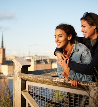 A lesbian couple at a viewpoint in Stockholm