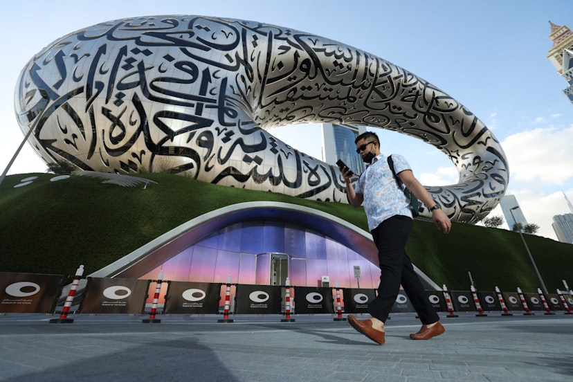 A man walks on February 7, 2022 past Dubai's Museum of the Future, which will open to the public on February 22. - The Gulf emirate's new building was named one of the 14 most beautiful museums on the planet in a list compiled by National Geographic magazine last summer. (Photo by Karim SAHIB / AFP) (Photo by KARIM SAHIB/AFP via Getty Images)