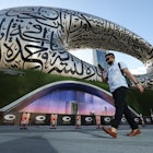 A man walks on February 7, 2022 past Dubai's Museum of the Future, which will open to the public on February 22. - The Gulf emirate's new building was named one of the 14 most beautiful museums on the planet in a list compiled by National Geographic magazine last summer. (Photo by Karim SAHIB / AFP) (Photo by KARIM SAHIB/AFP via Getty Images)