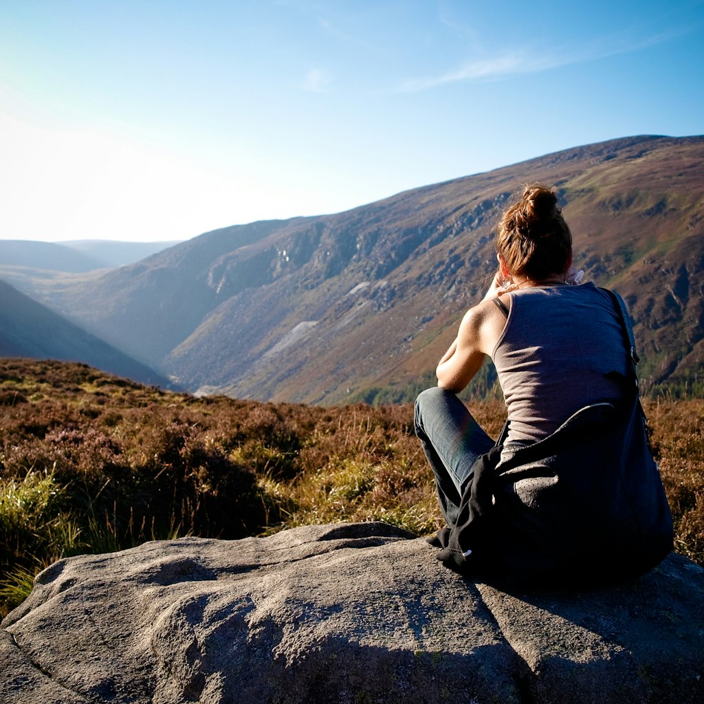 A woman looking at the view in the Wicklow Mountains